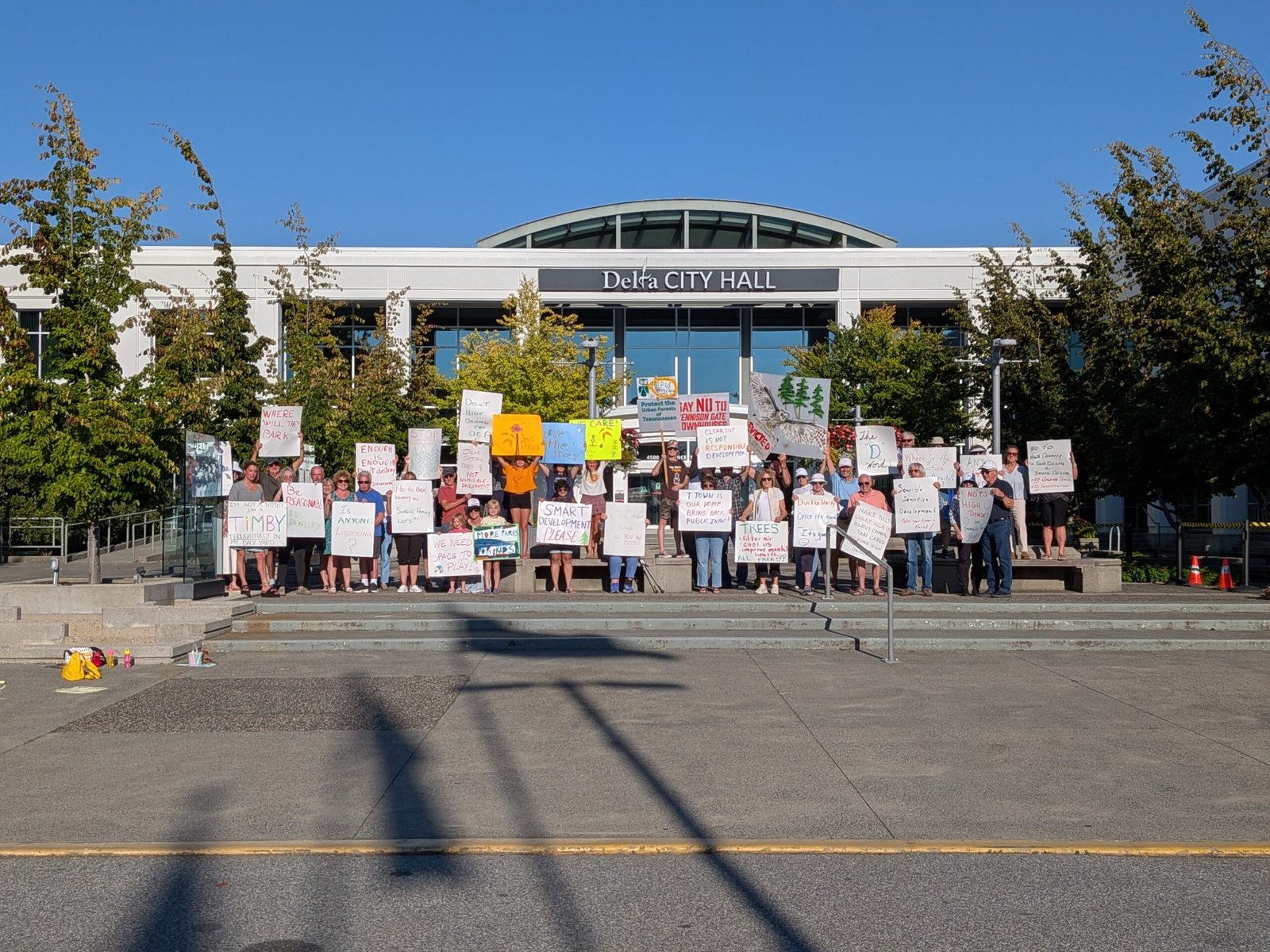 Residents gathered on the steps of Delta City Hall